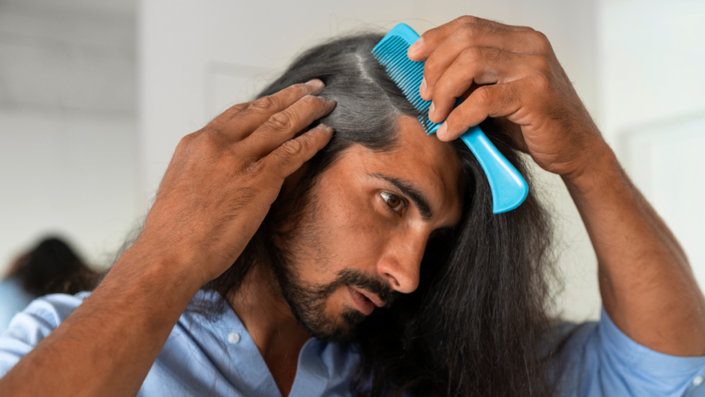 A man looking his white hair in front of mirror